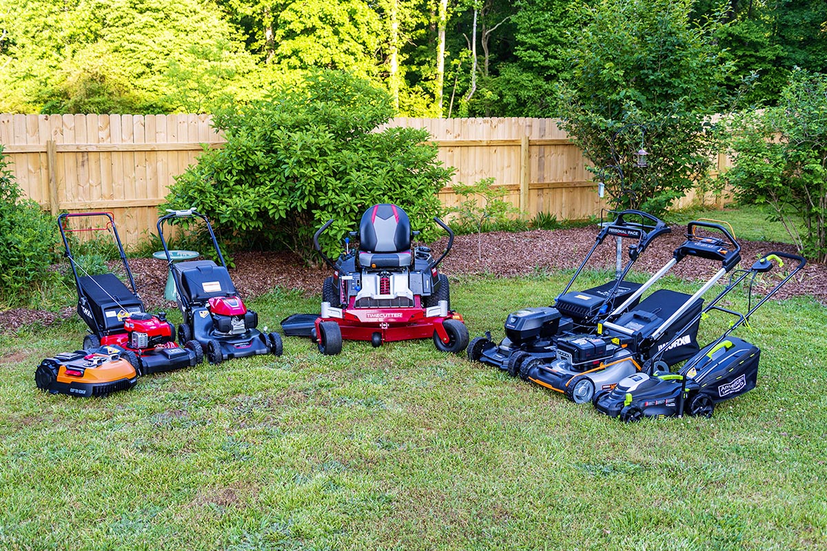 A group of the best lawn mowers together in a yard