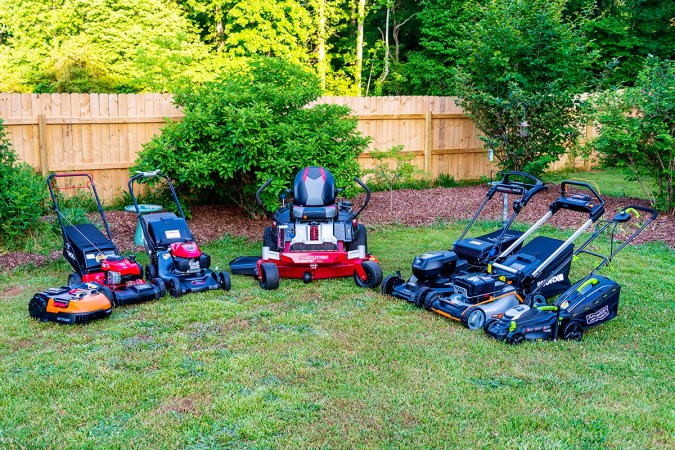 A group of the best lawn mowers together in a yard