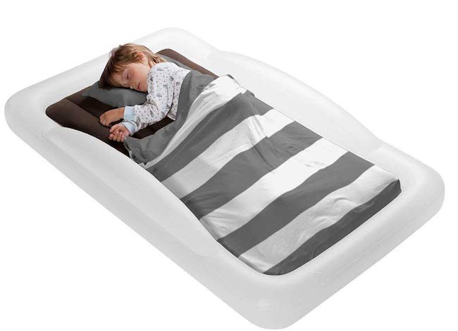 Child sleeping on The Shrunks toddler travel bed
