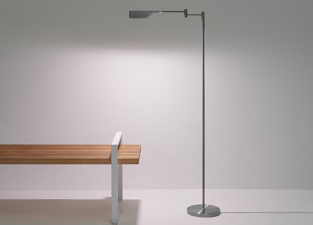 A sleek wood bench as well as pharmacy floor lamps.