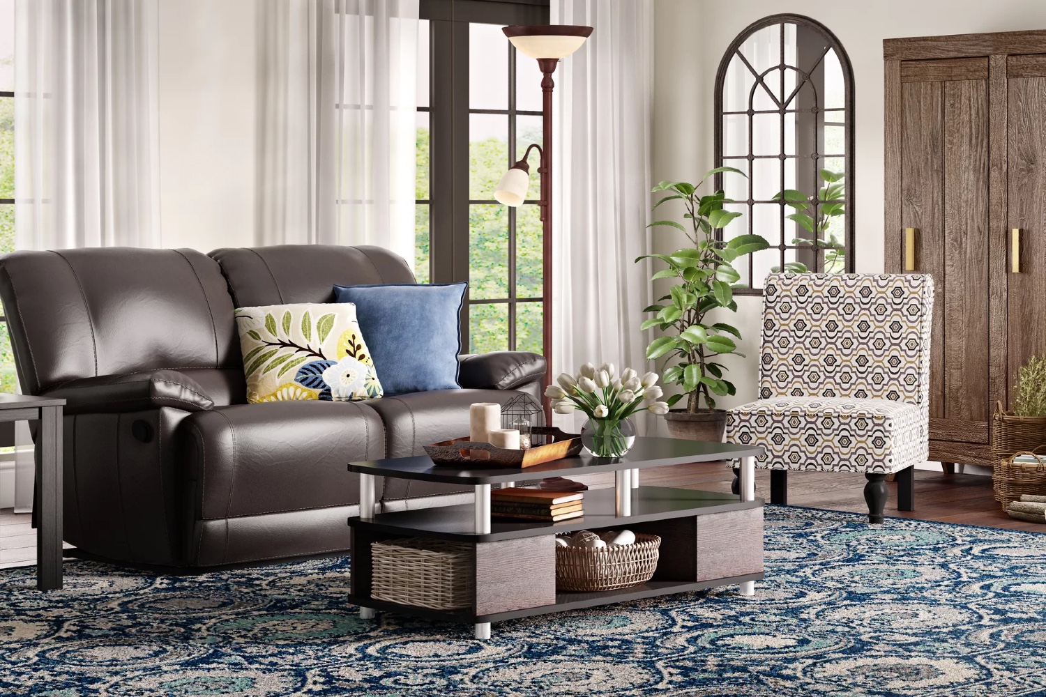 The Best Reclining Loveseat on top of a blue patterned rug with two pillows placed on it.