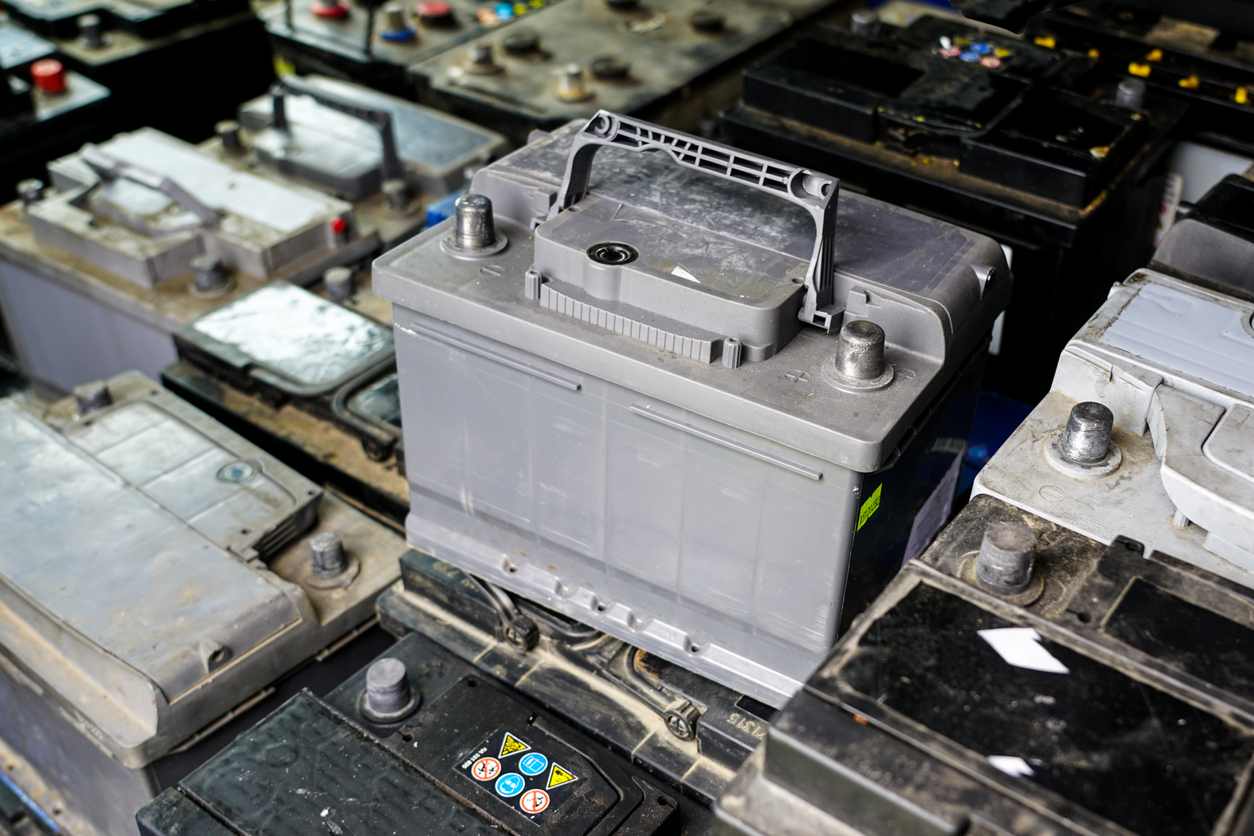 how to change a car battery stacks of car batteries to be recycled