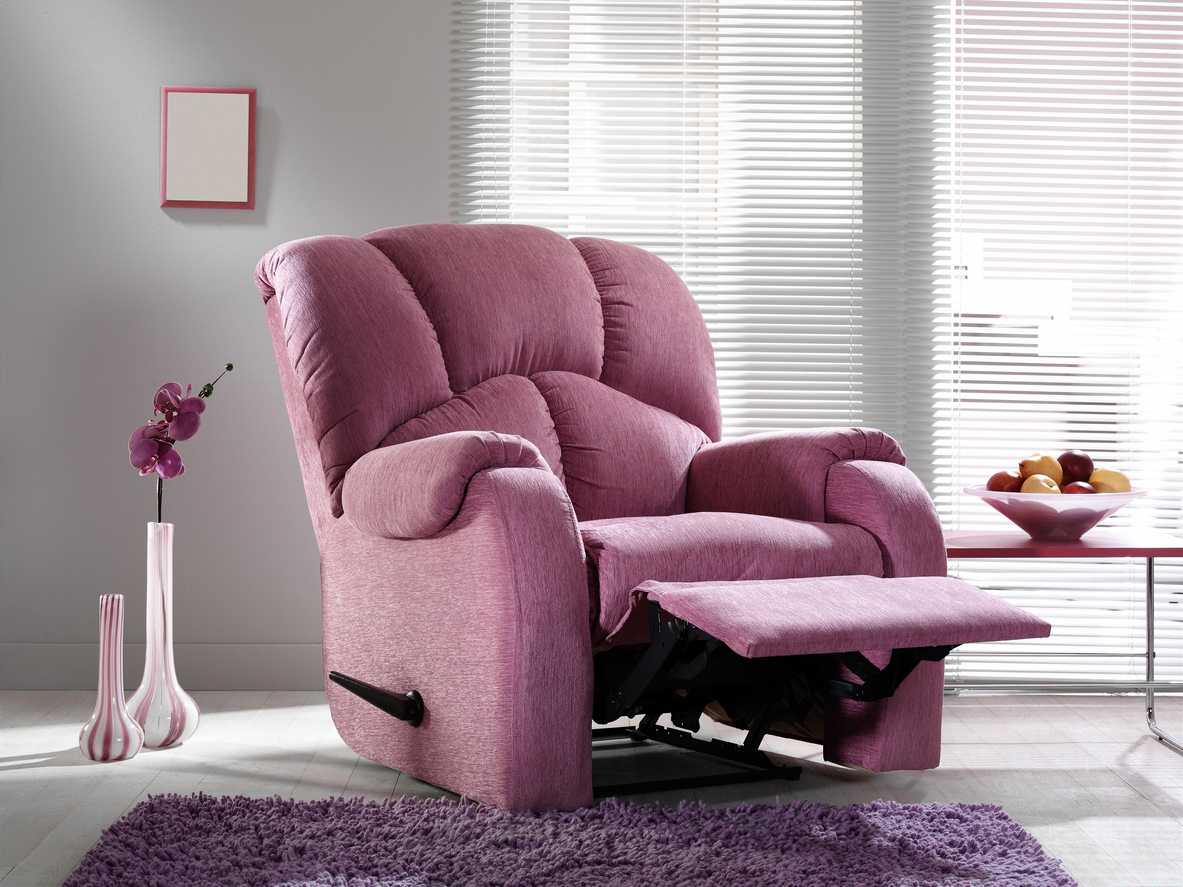 The best recliner for sleeping option reclined in a pink and purple living room