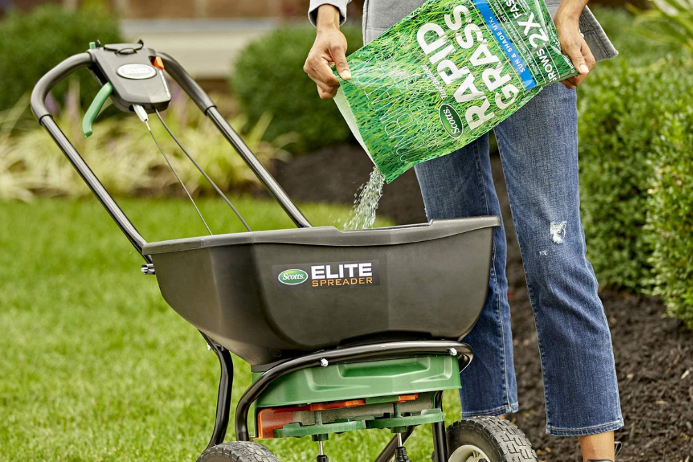 The best grass seed for shade option being poured into a seed spreader
