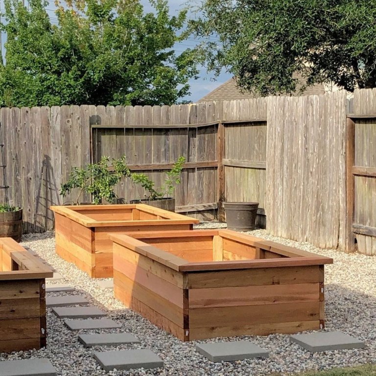 Cedar Raised Garden Bed Plans assembled on a gravel patio