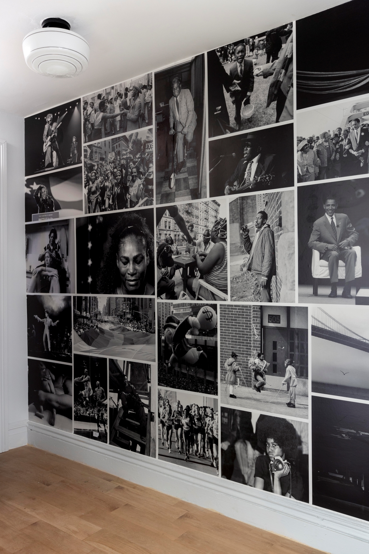 Wall of black and white photos.