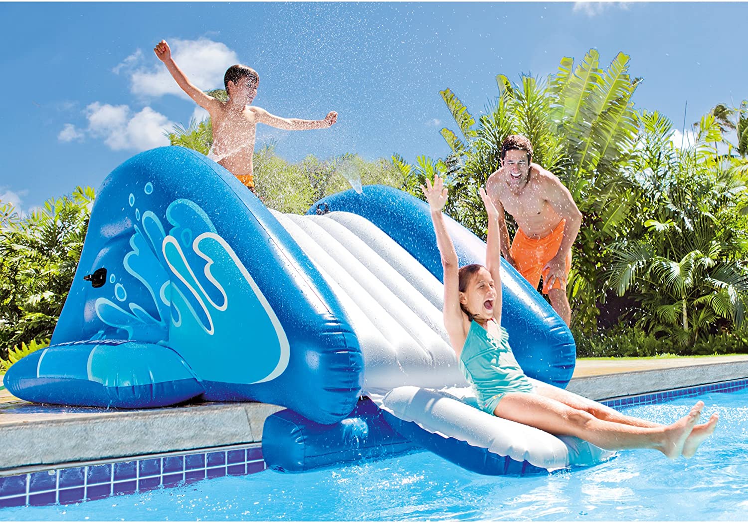 A group of children having fun playing on the best inground pool slide option