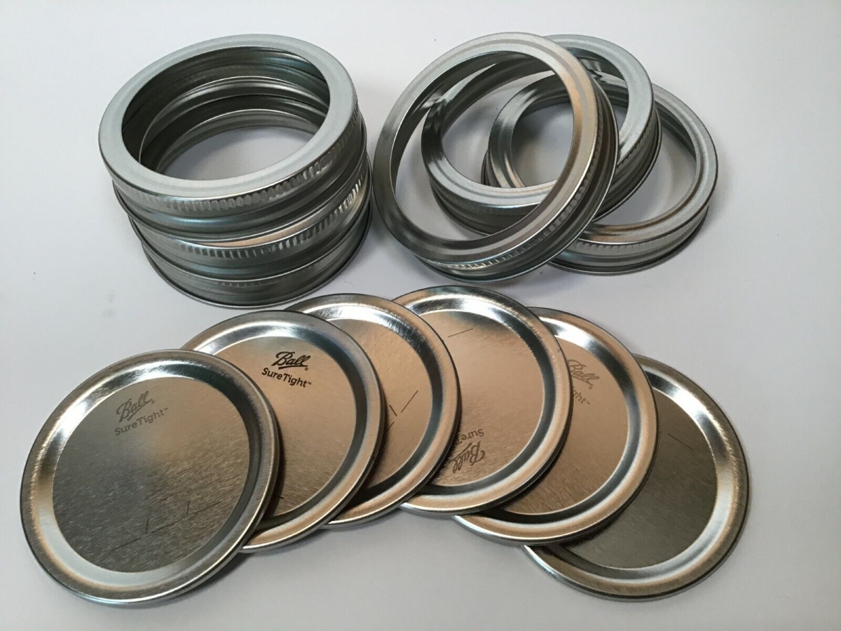 A set of six Mason jar lids and rings.
