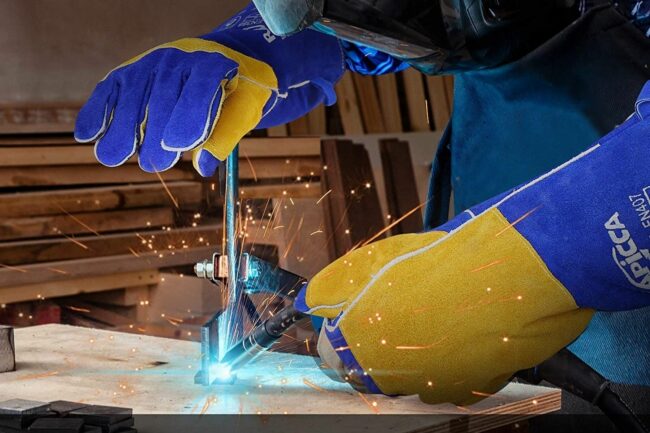A person using Rapicca welding gloves while welding