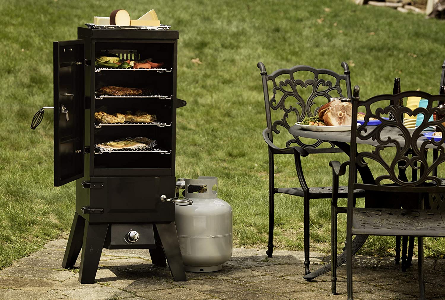 The best smoker for beginners option on an outdoor cement patio