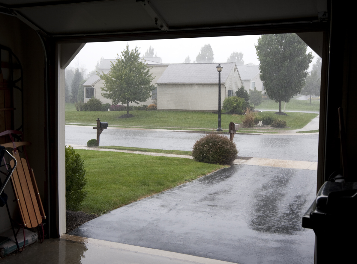 view from inside garage of rain outside