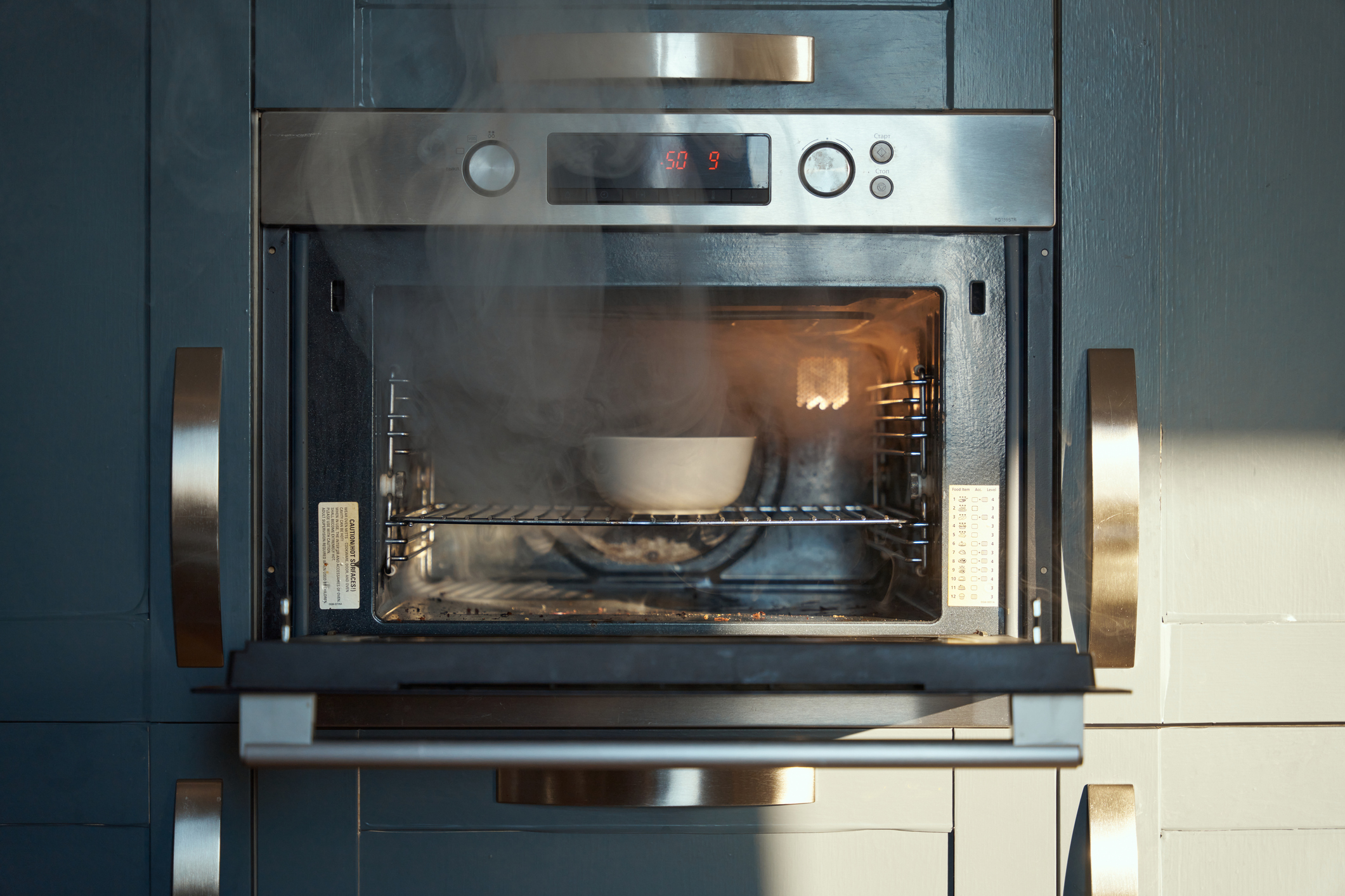 Using a bowl with water to steam clean and oven.