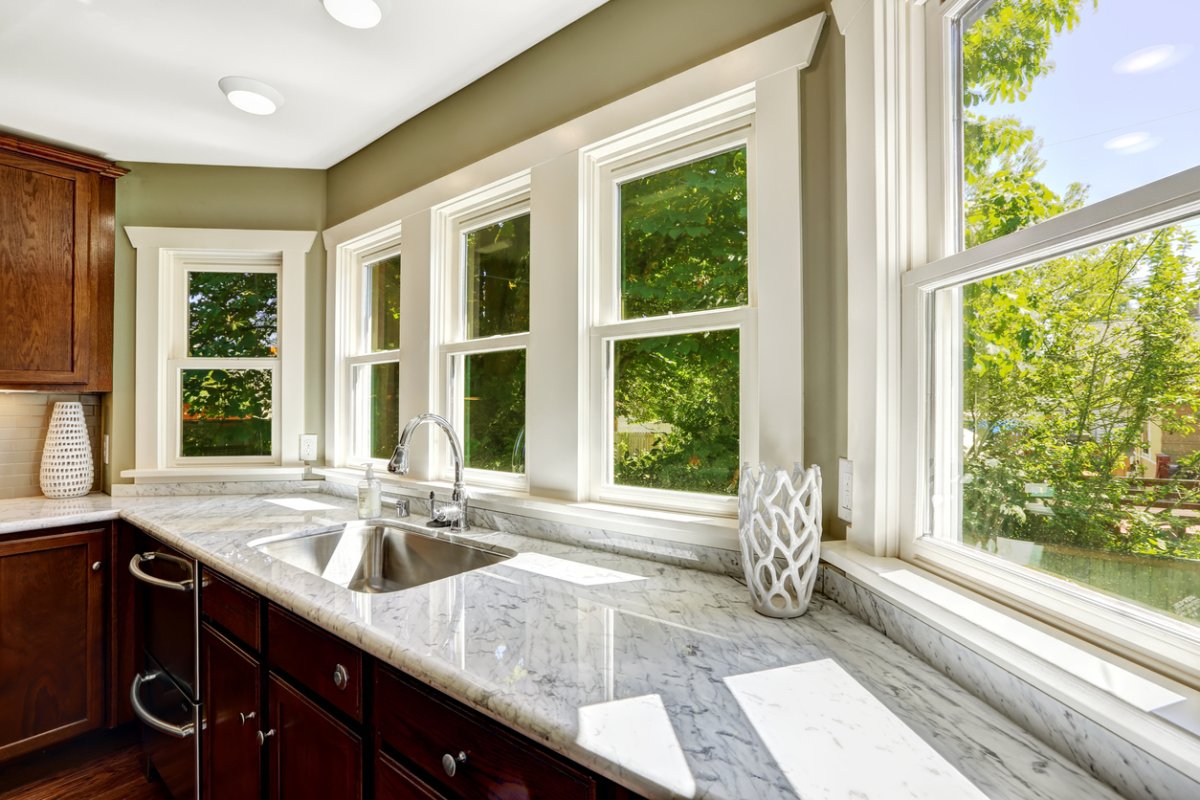 A series of windows in a clean, bright kitchen on a sunny day.