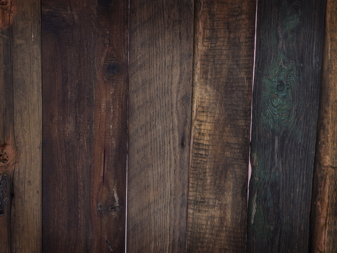 Wooden boards stained a very dark brown.