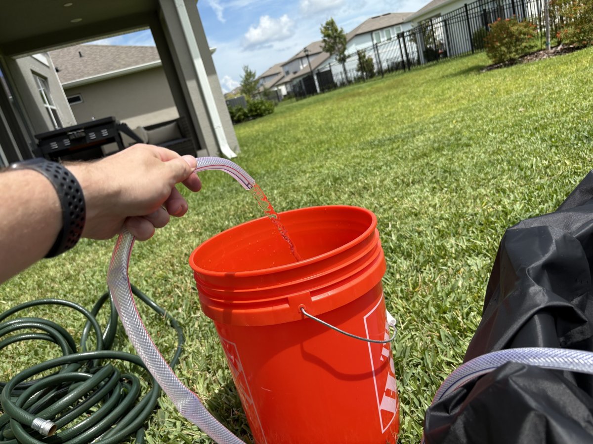 Agiiman pool cover pump hose in a bucket