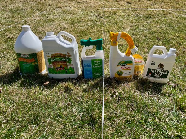 Liquid lawn fertilizers group on grid before use