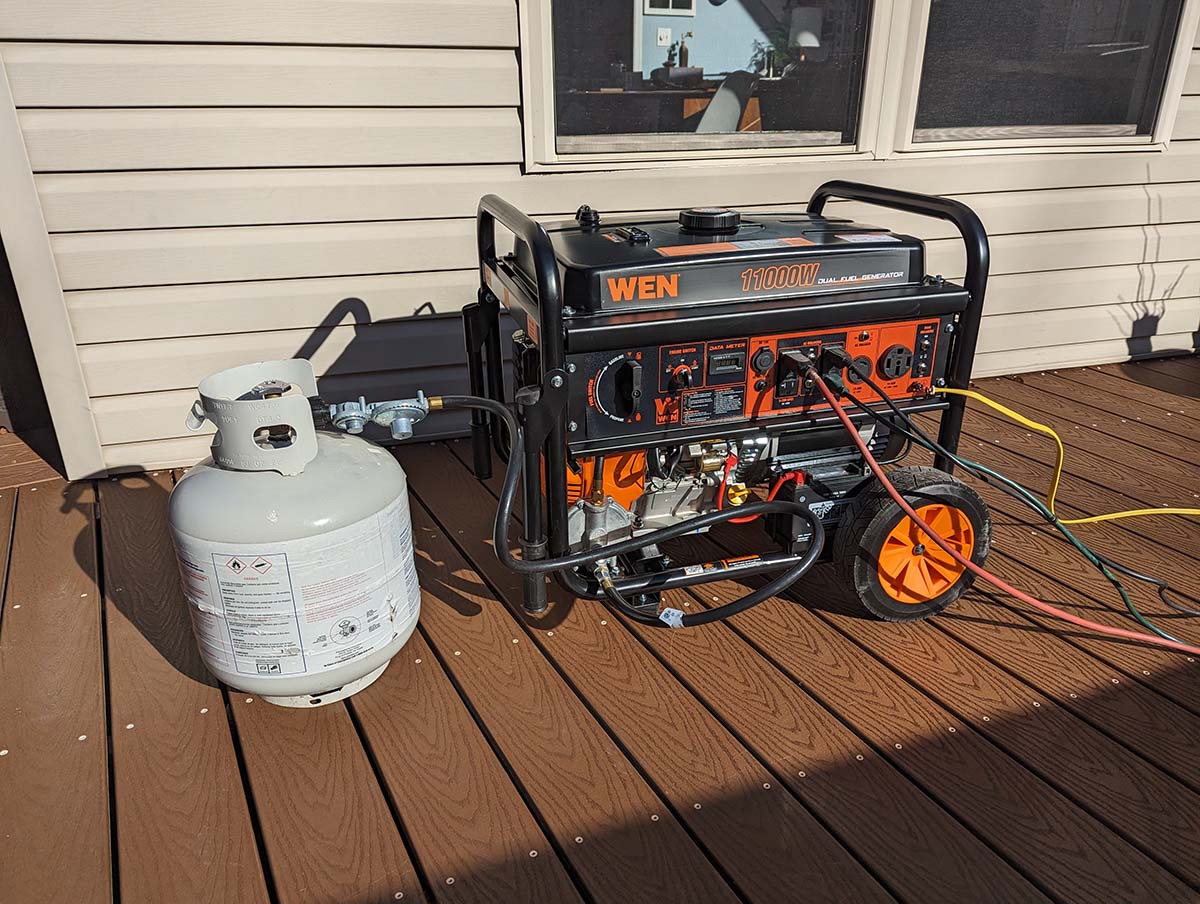 Black and orange Wen propane generator outside on deck