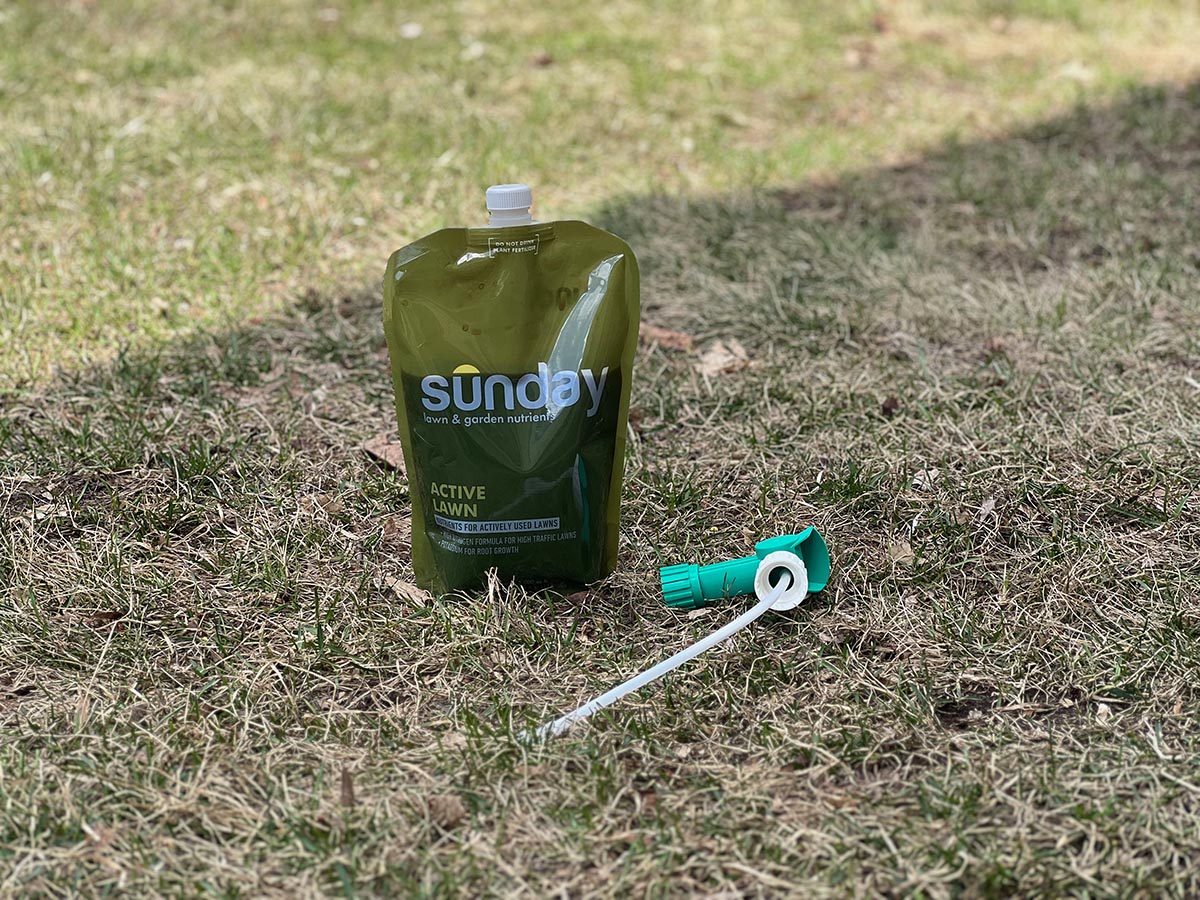 A close up of a Sunday lawn care product pouch.