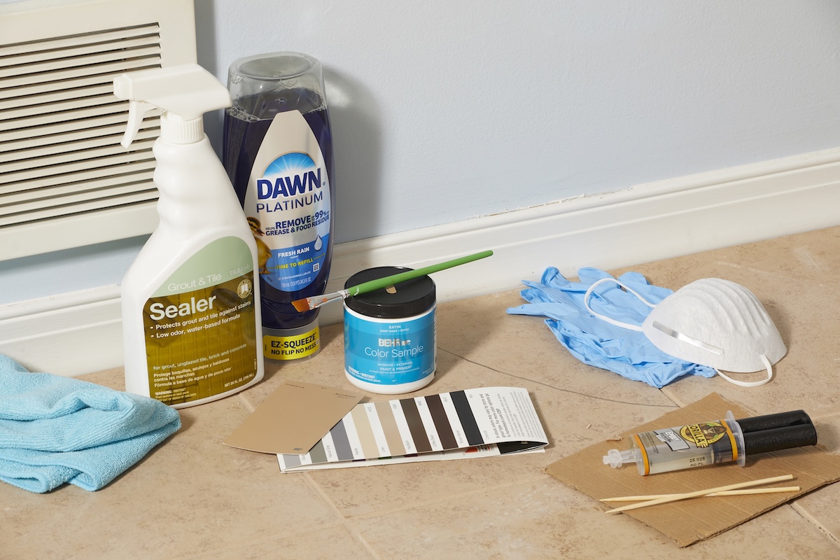 Materials needed for repairing a cracked tile including cleaner, epoxy, tile paint, and more.