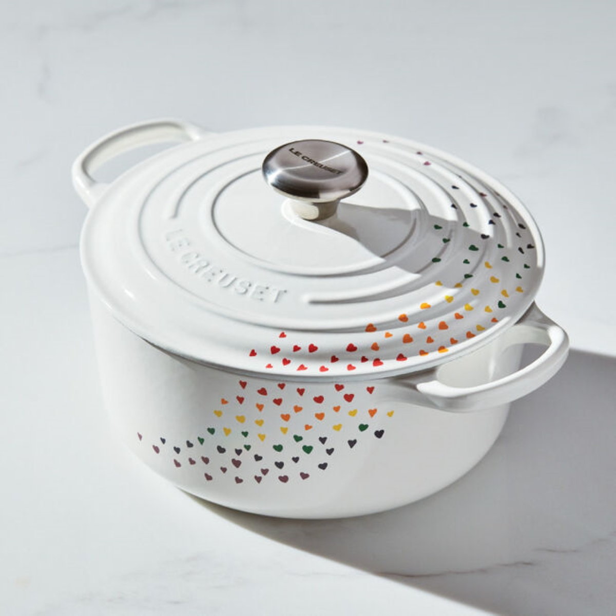 White dutch oven with rainbow hearts