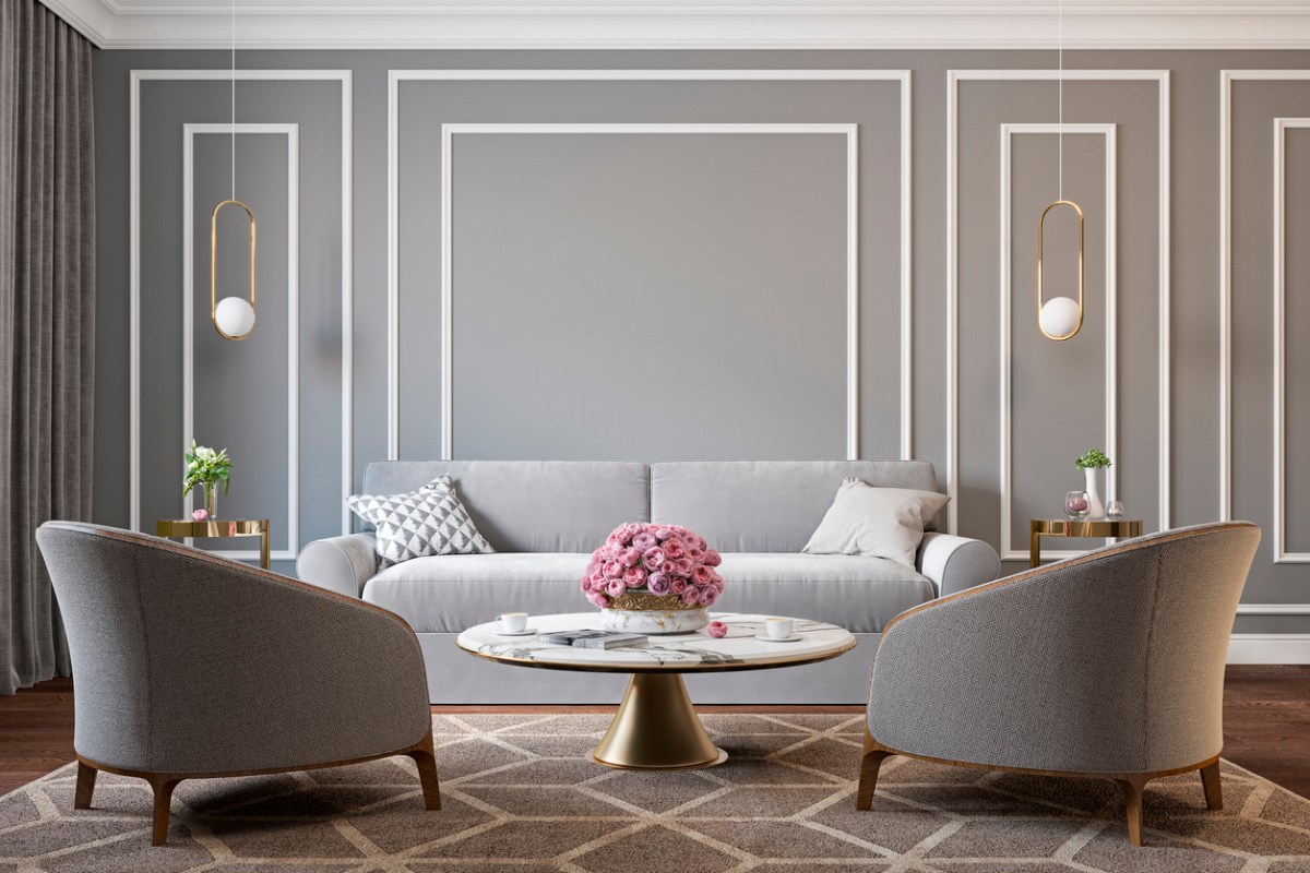 Living room with gray walls, white trim, and gold accents