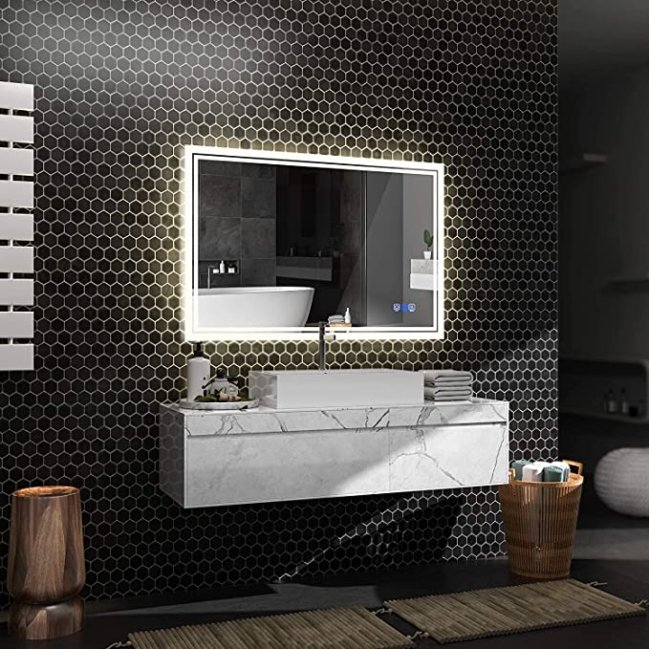 3D render of an Anten LED Backlit Mirror on a black hexagonal tile wall
