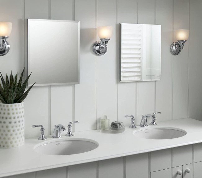 Two square Kohler medicine cabinet mirrors hanging over a double vanity sink