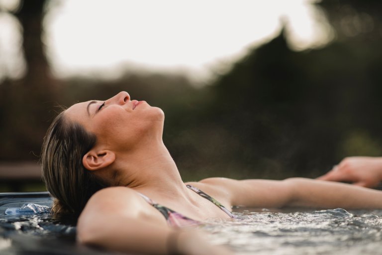 backyard hot tub privacy ideas woman in hot tub