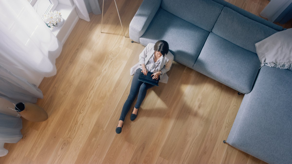 flooring surprises woman sitting on floor