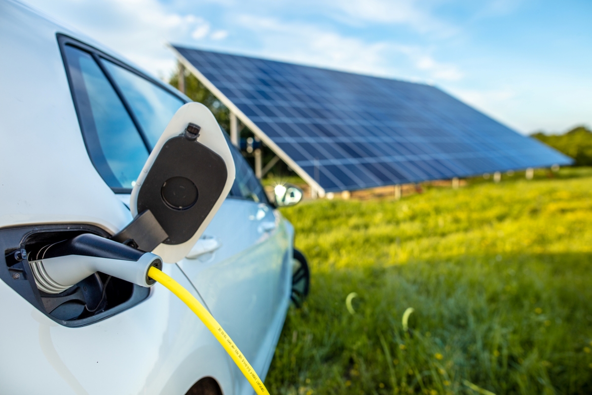 Solved! How to Use Your Home's Solar Panels to Charge Your Electric Car - charging with solar panels in background