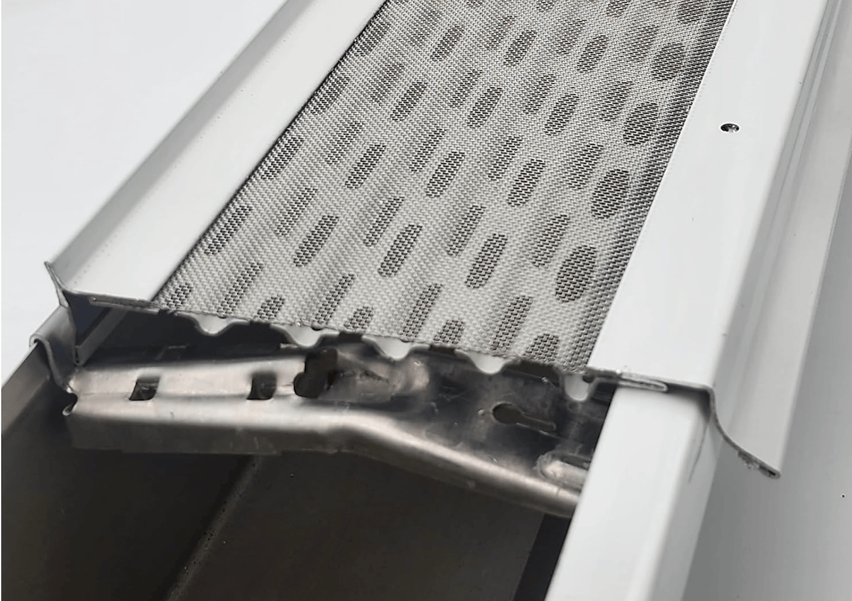 Fine, micro-mesh gutter guard made of metal.