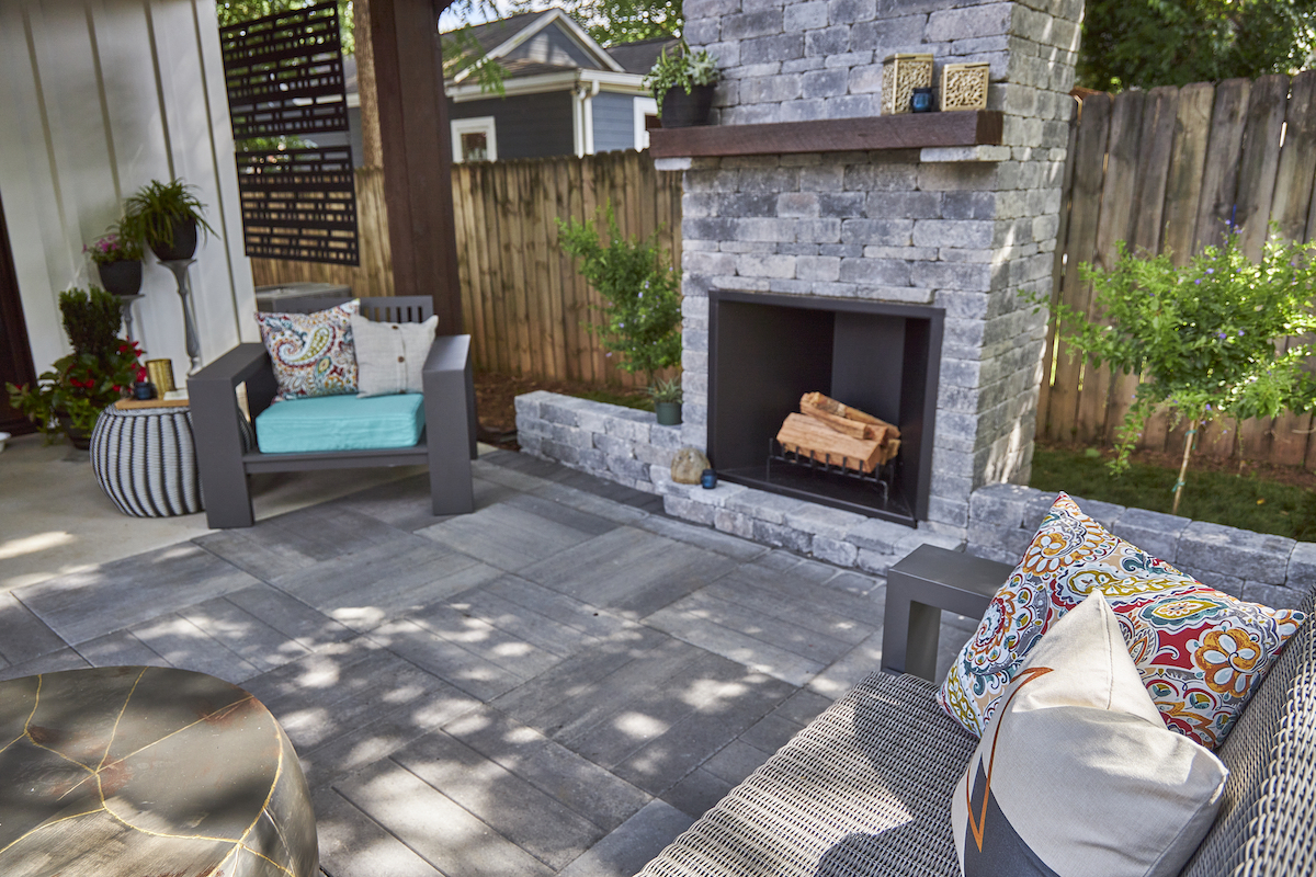 Pavestone patio and outdoor fireplace - outdoor living trends 2022