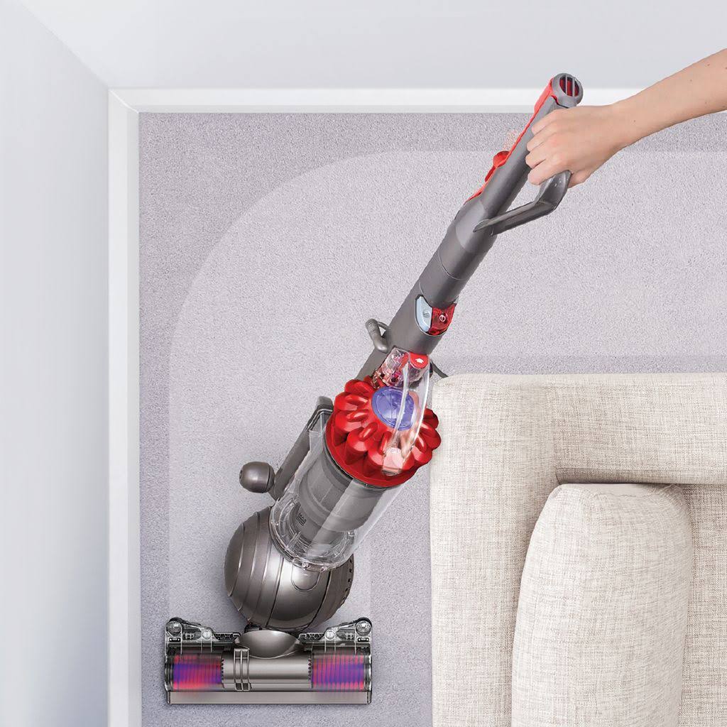 A vacuum in the corner of the room