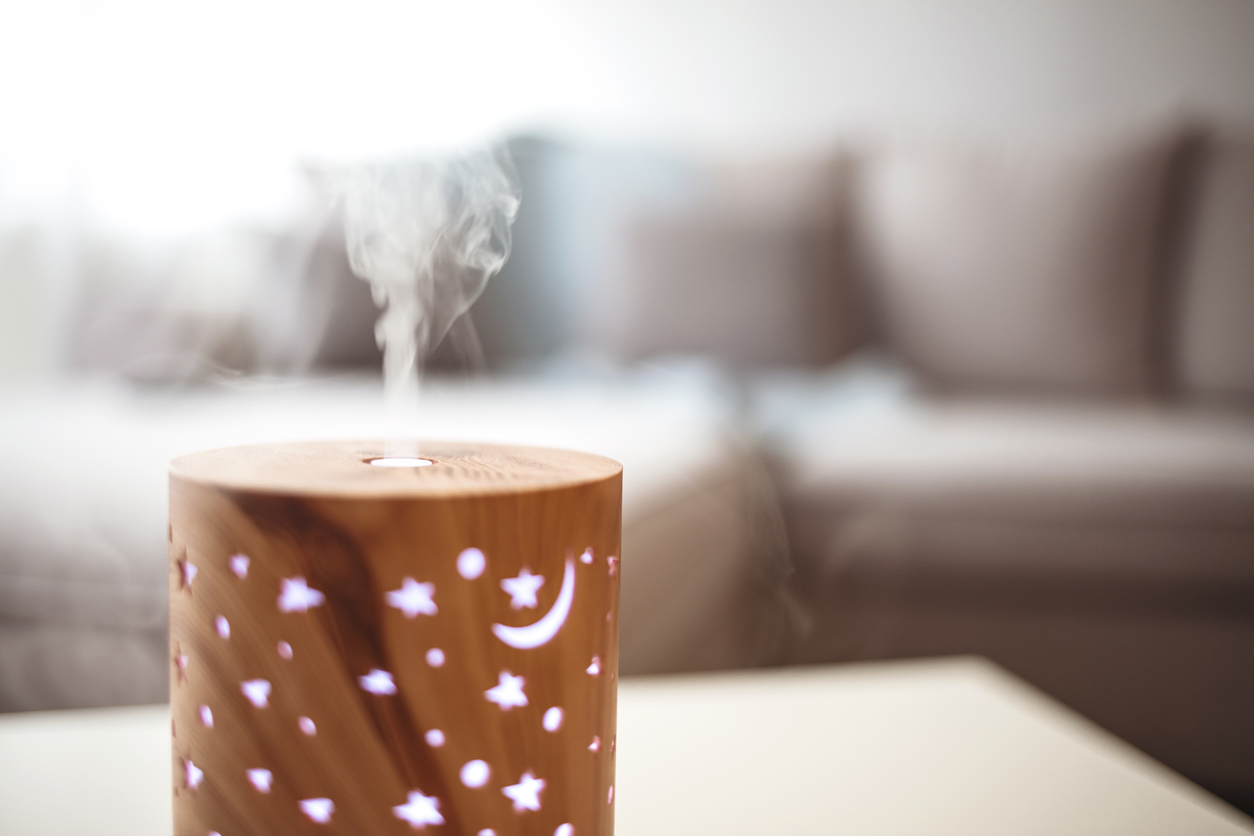 Closeup of an essential oil diffuser with moon and stars pattern