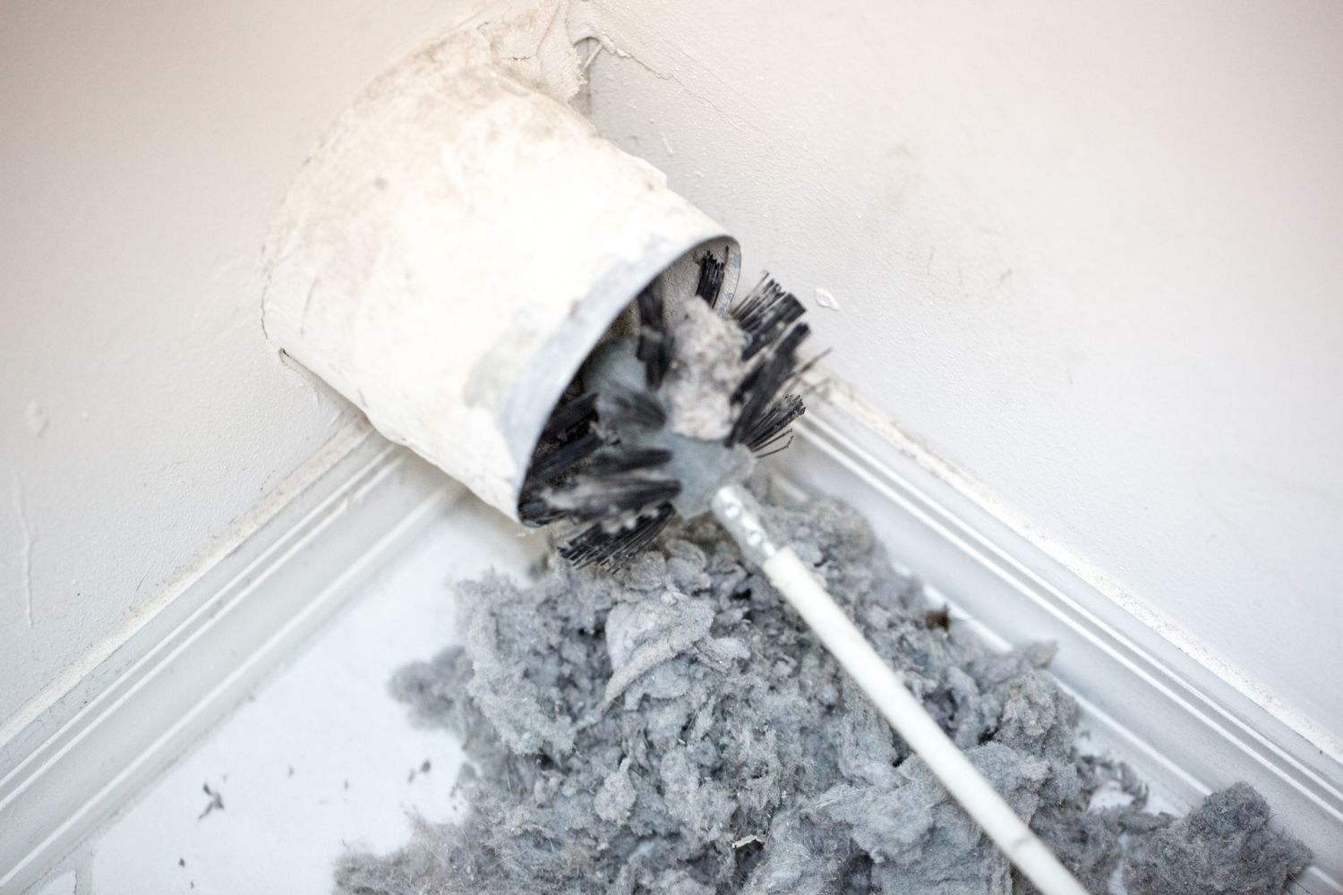 A dryer vent in the process og being cleaned. 