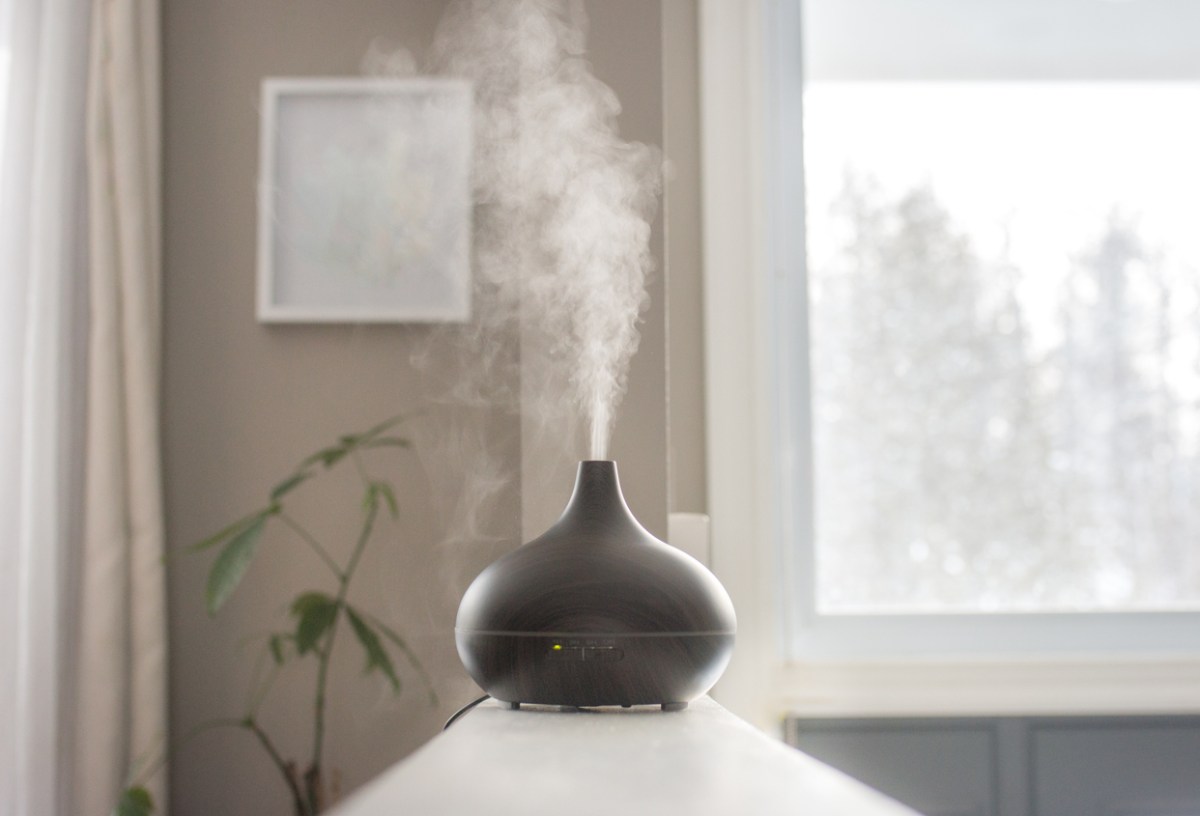 Essential oil diffuser blowing steam indoors
