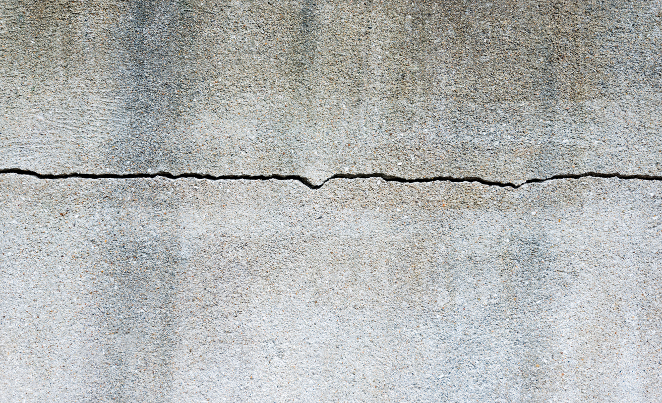 House settling crack in concrete foundation