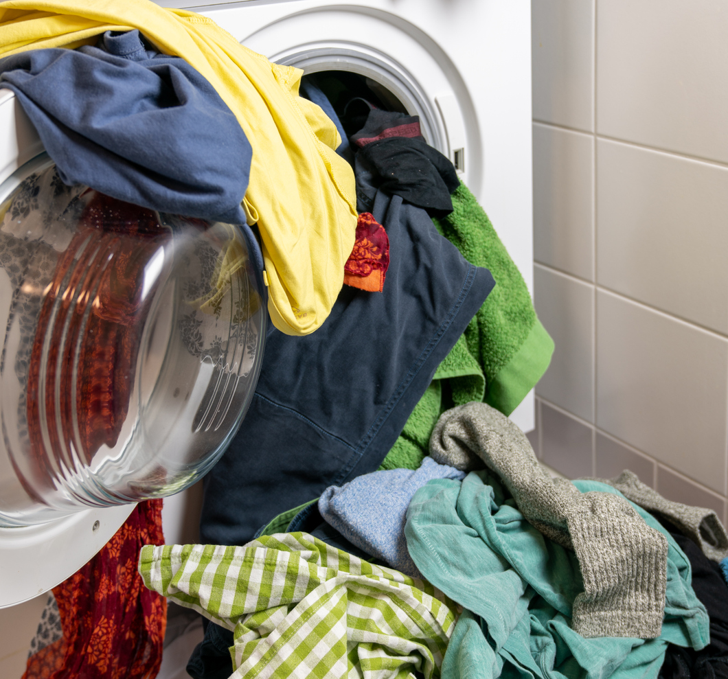 iStock-1197505485 appliance maintenance overloaded washing machineiStock-1197505485 appliance maintenance overloaded washing machine