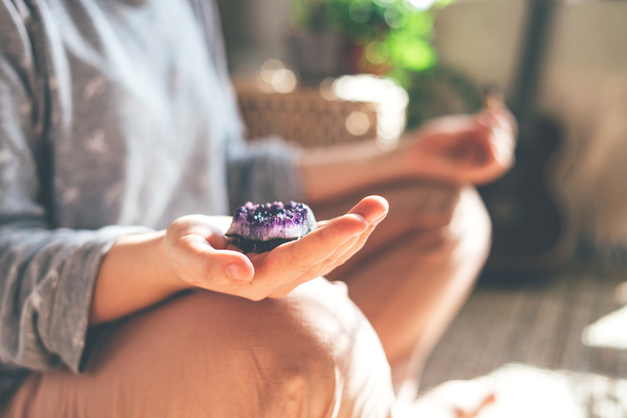 iStock-1218786158 where can I find crystals? woman meditating with crystal