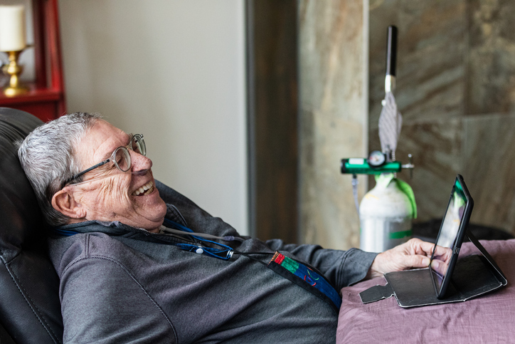 home-health-care-man-with-oxygen-tank-laughing