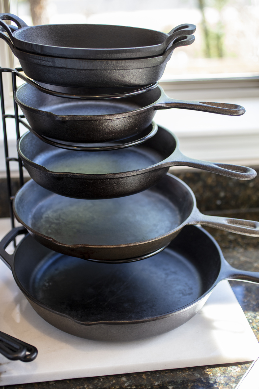 cast iron cookware on rack