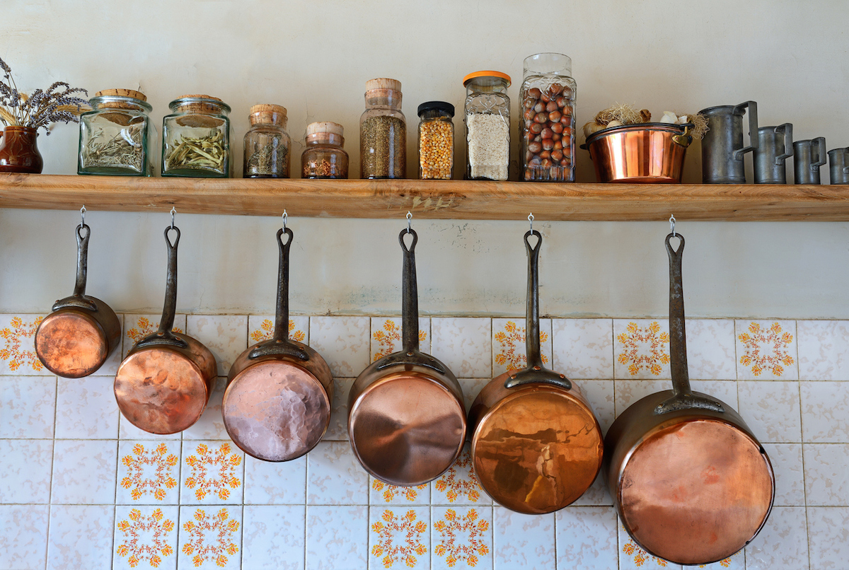 copper cookware hanging in kitchen