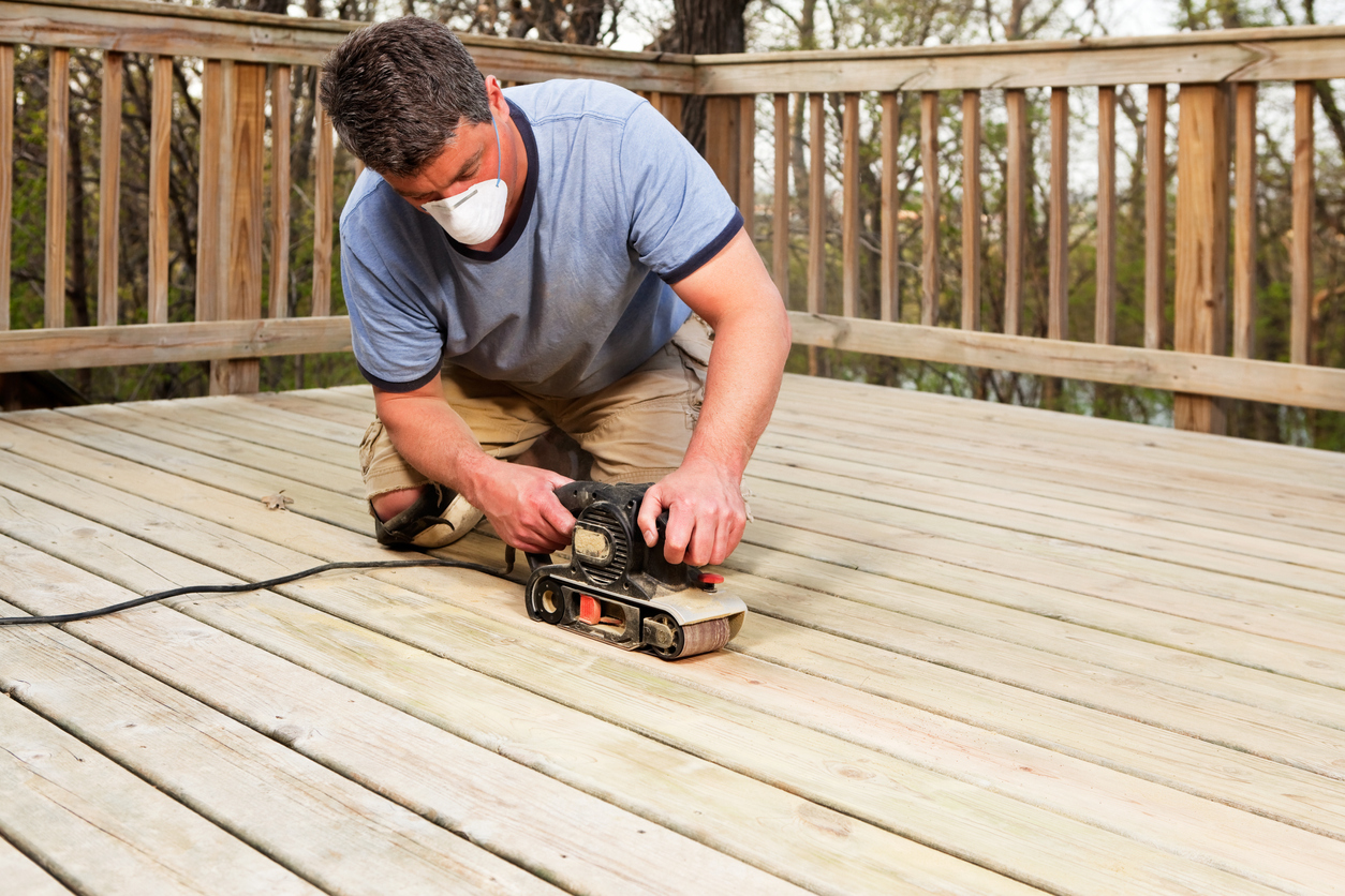 iStock-493608727 composite vs. wood deck sanding wood deck planks