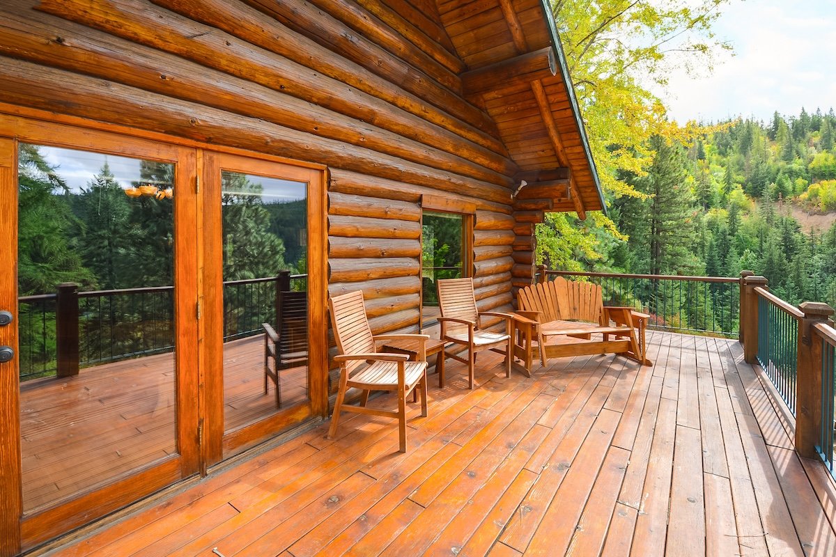 A rustic log cabin like a large wooden deck.