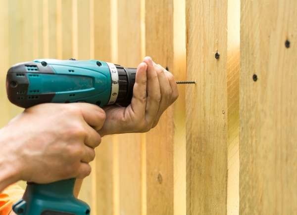The Most Affordable Ways to Fence in a Yard: Treated Pine