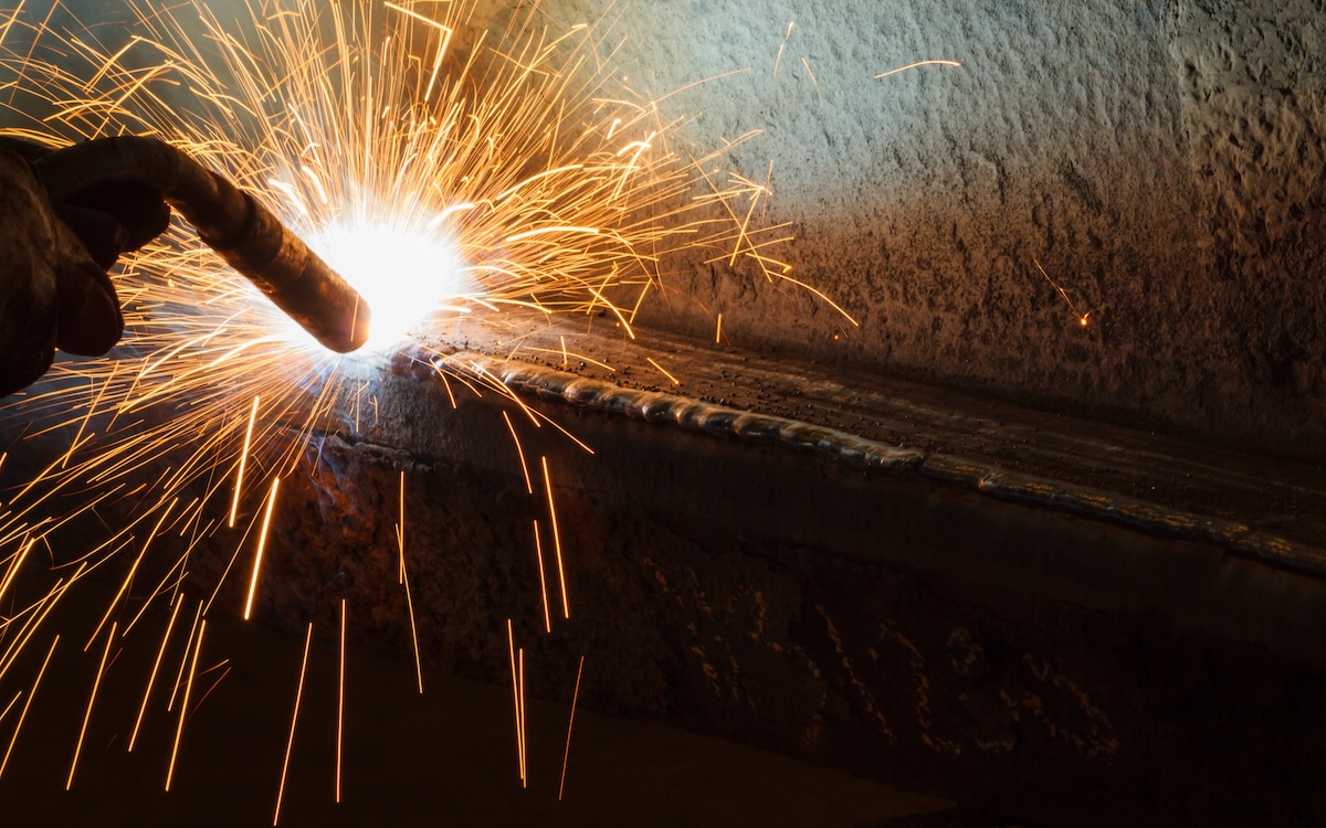 Sparks fly from a MIG welding project. 