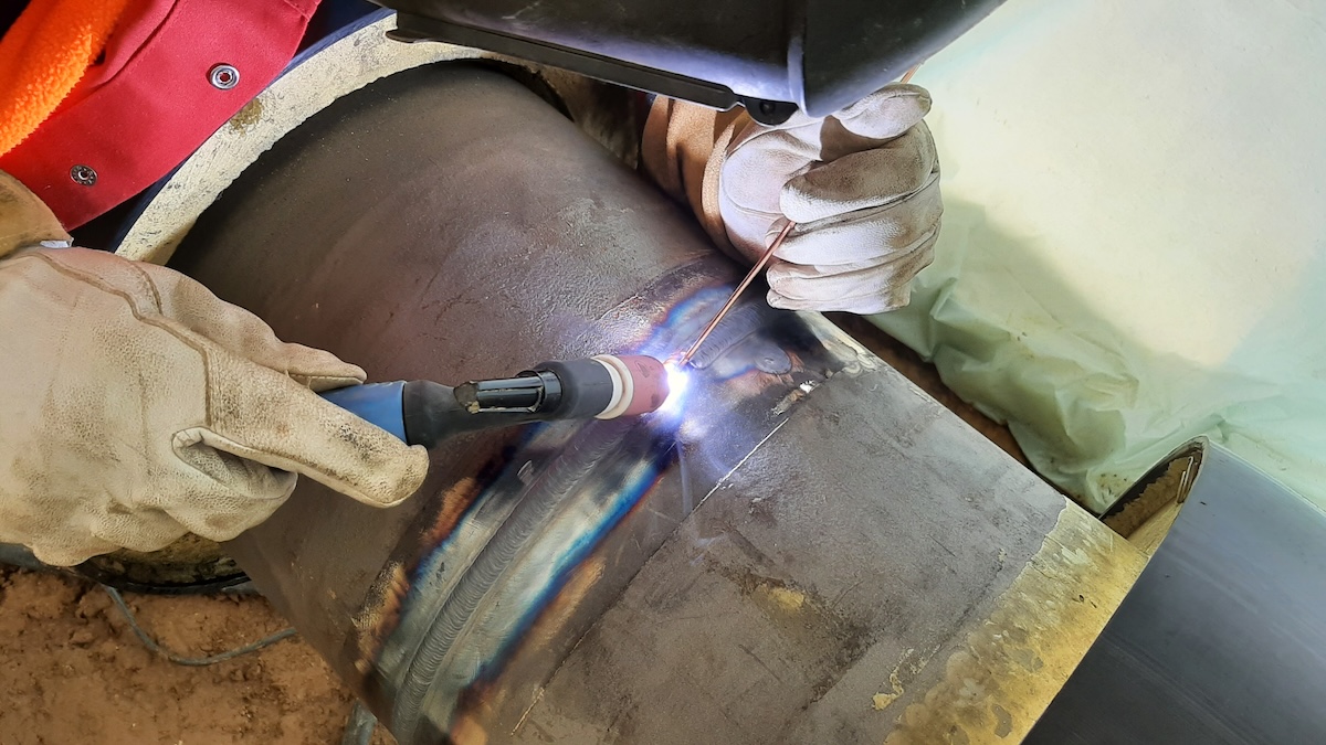 A TIG welder creates a seam in a tungston structure. 