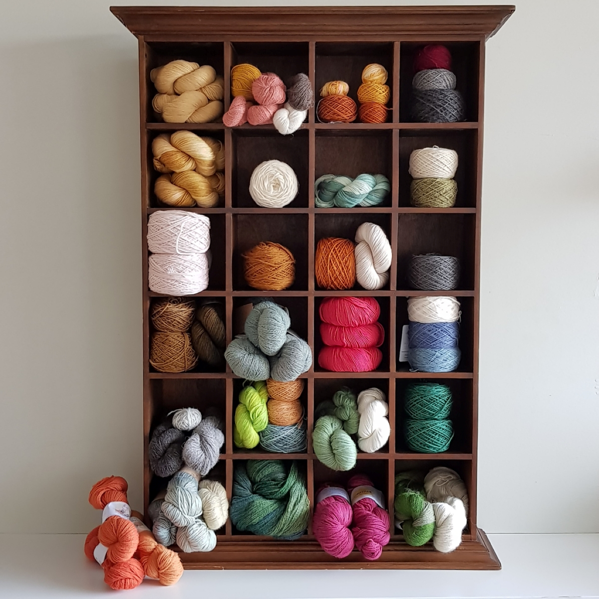 craft room ideas - colorful yarn in cubbies