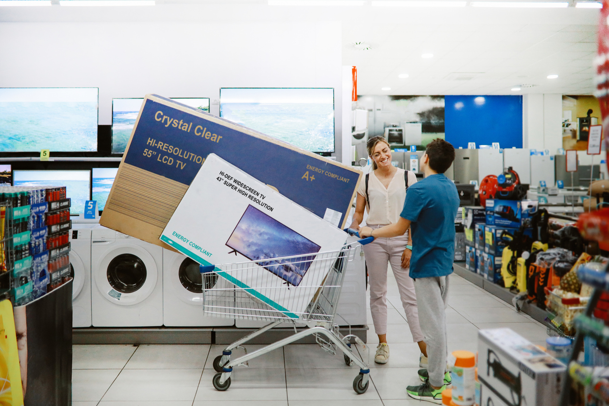 iStock-1333807917 rebates and tax credits mom and son buying two TVs.jpg