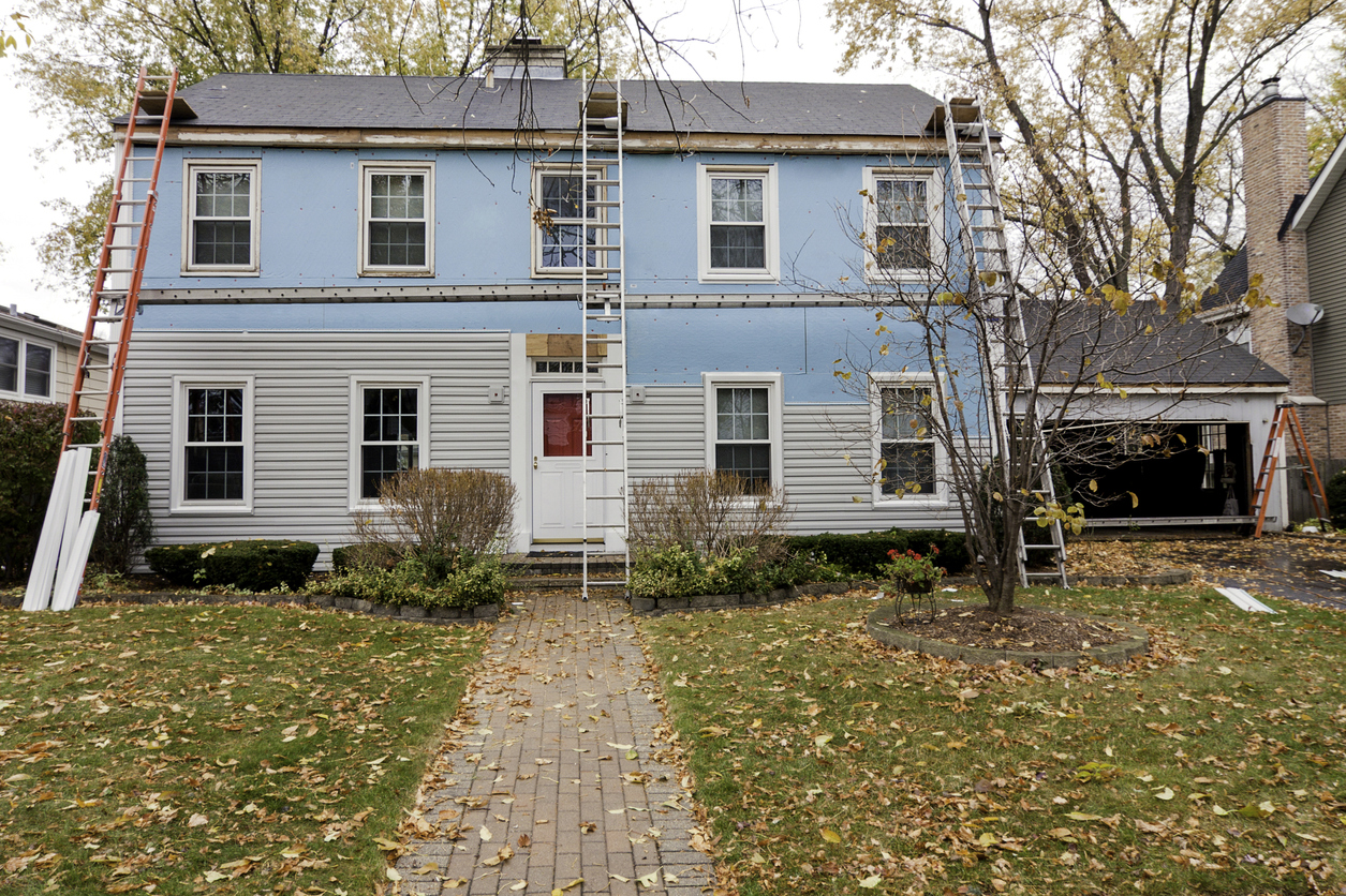 Renovating old, blue colonial home.
